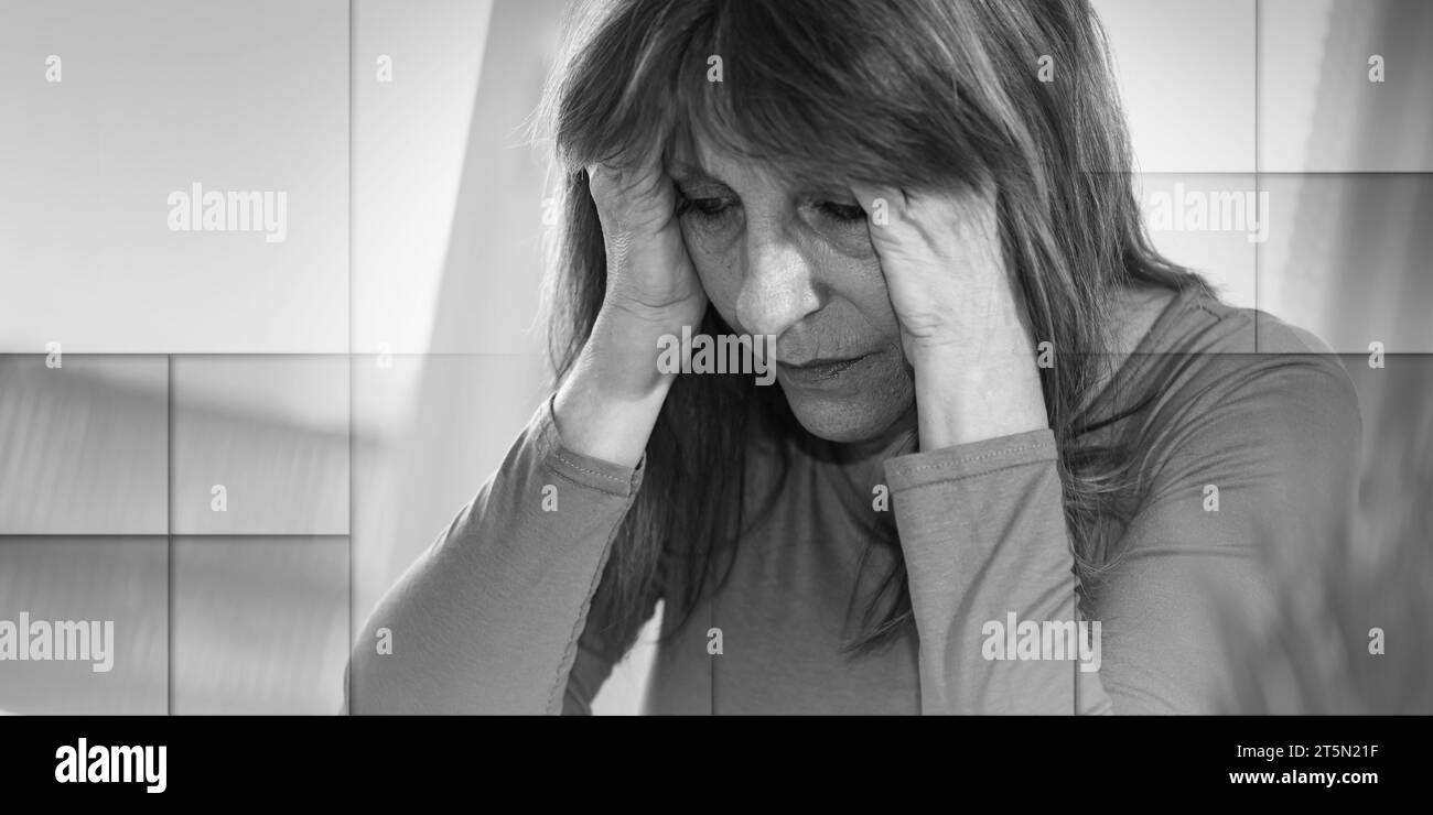 Femme d'affaires épuisée assise dans le bureau avec les mains sur le front, motif géométrique Banque D'Images