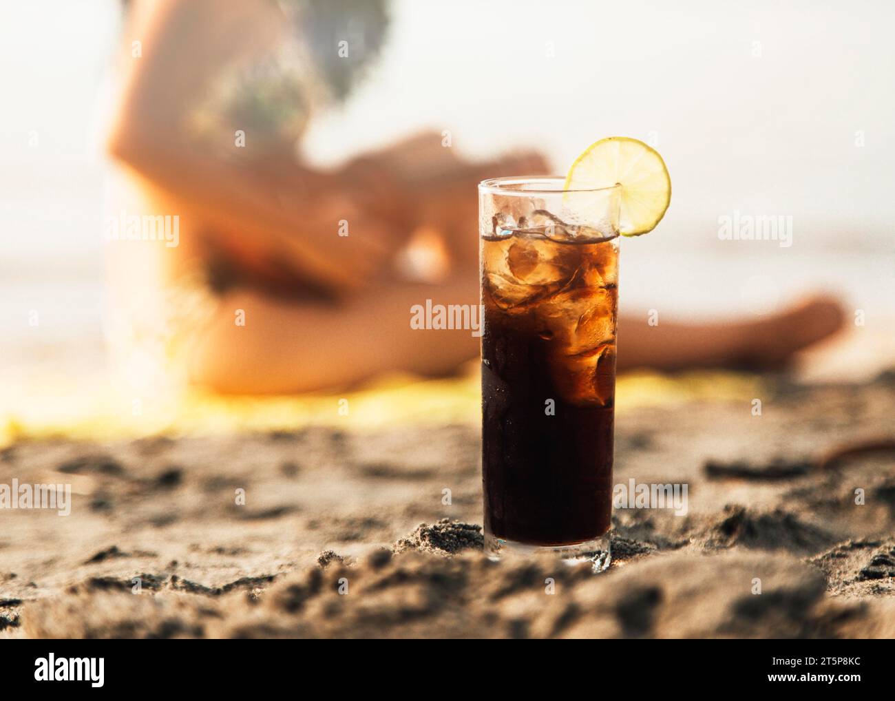 Coke de verre avec plage de glace Banque D'Images