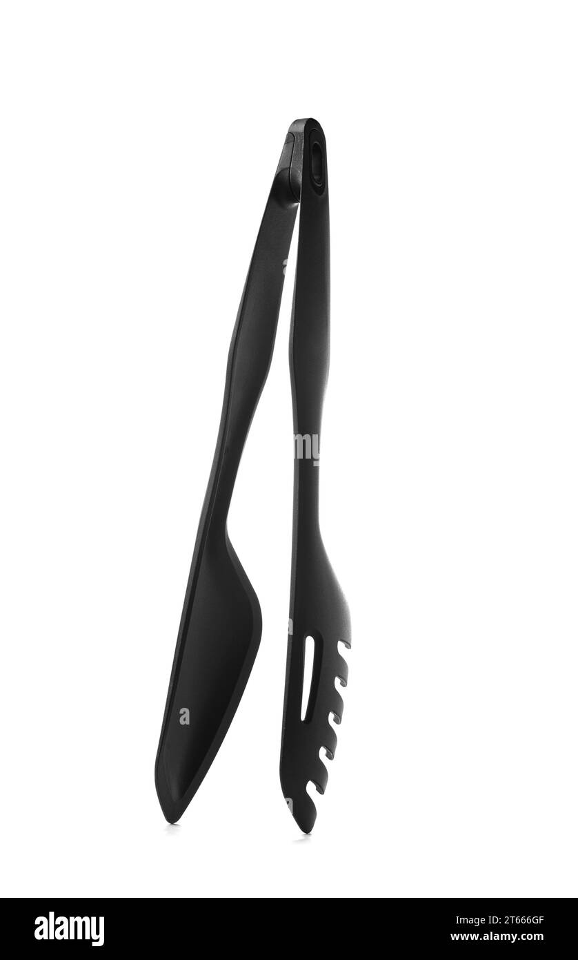 Pinces de cuisine noires démontables avec support éco-plastique. Ustensiles de cuisine pratiques pour préparer et servir des plats. Articles ménagers ergonomiques fabriqués Banque D'Images