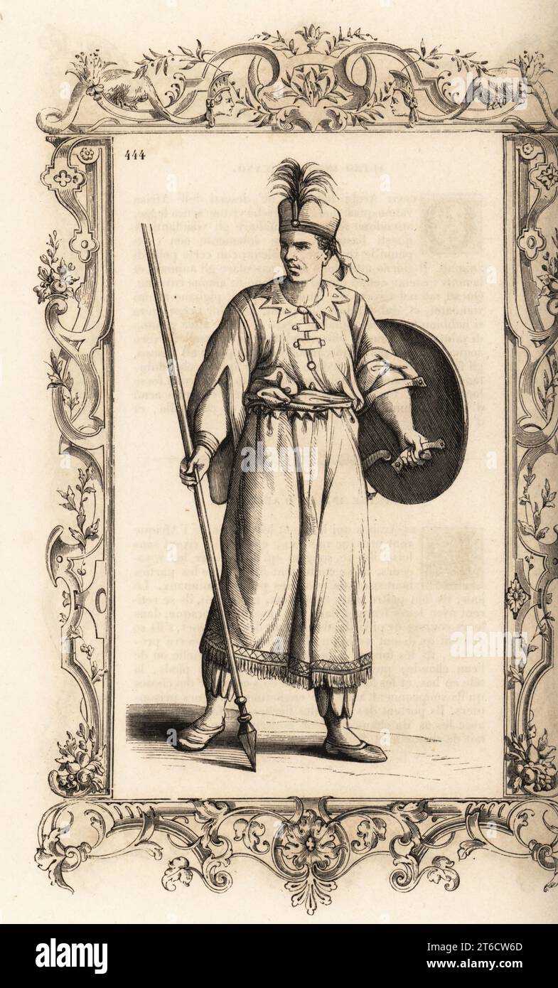 Guerrier du royaume africain de Djebel ou Giabea. Il porte une targe ou un bouclier rond et une lance empoisonnée ou assegai. Costume de Djebel, Royaume dAfrique. Dans un cadre décoratif gravé par H. Catenacci et Fellmann. Gravure sur bois de Gerard Seguin et E.F. Huyot d'après une gravure sur bois de Christoph Krieger de Cesare Vecellios costumes anciens et modernes du 16e siècle, Habiti antichi et moderni di tutto il mondo, Firman Didot Ferris fils, Paris, 1859-1860. Banque D'Images