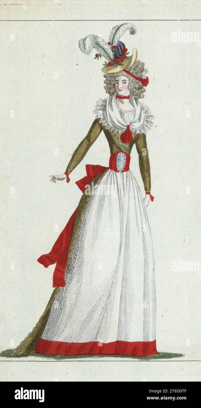 Femme en bonnet de paille décoré de fleurs de grenade, aigrette et cocarde, cheveux en annelets, ruban rouge choker, fichu de gaze de dentelle, dentelle tucker, robe de soie couleur feuilles mortes, ceinture nakara, jupon blanc. Gravure sur cuivre colorée à la main de Jean-Antoine le Brun ou Lebrun-Tossas Journal de la mode et du gout, anciennement Cabinet des modes, chez Buisson, Paris, et Joseph le Boffe, Londres, 26è Cahier, 5 novembre 1790. Banque D'Images