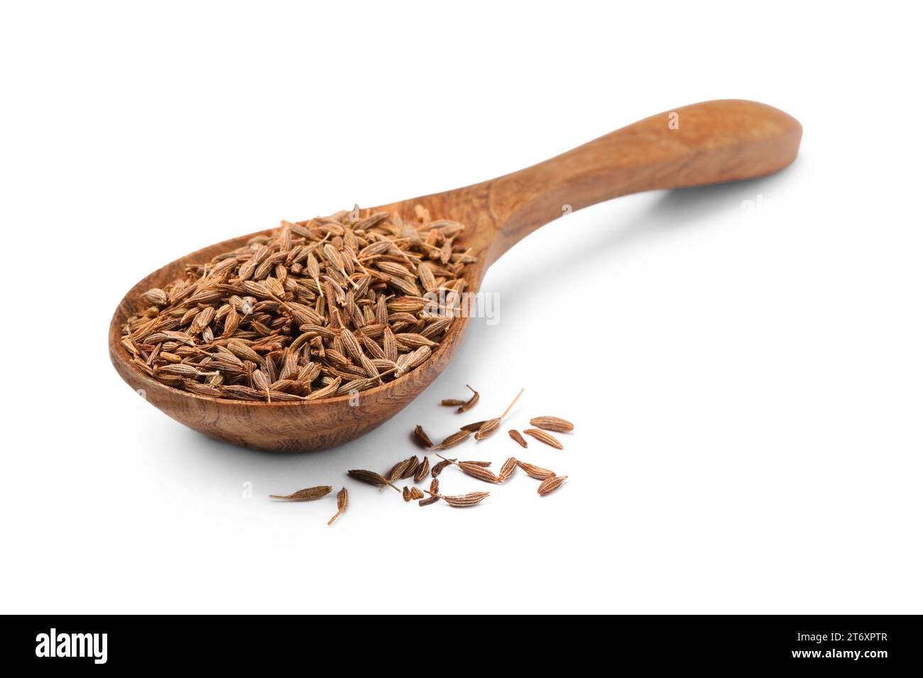 Cuillère de graines de carvi aromatique (cumin persan) isolées sur blanc Banque D'Images