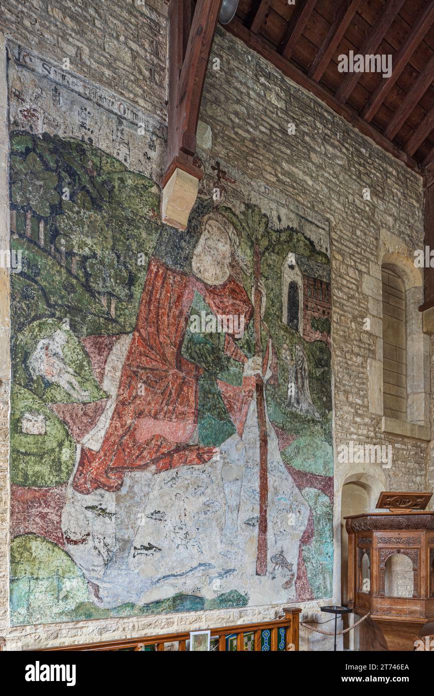 Peinture murale du 14e siècle de St Christopher dans l'église du 12e siècle de St Mary Magdalene dans le village Cotswold de Baunton, Gloucestershire UK Banque D'Images