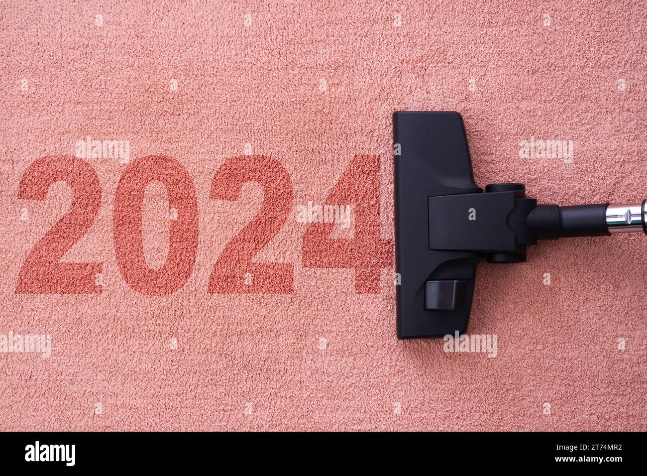 2024 nettoyage de la maison du nouvel an avec aspirateur et espace de copie pour un texte Banque D'Images