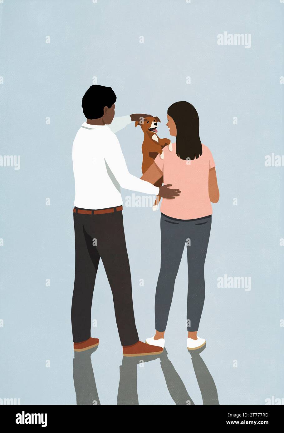 Couple tenant et caressant chien chiot mignon sur fond bleu Banque D'Images