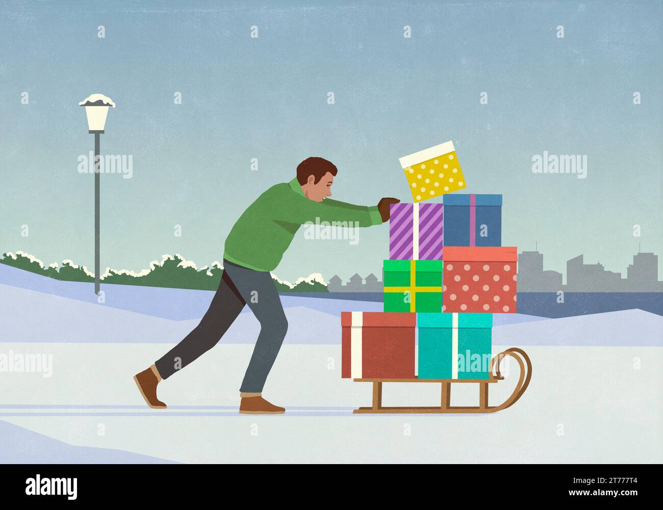Homme poussant le traîneau empilé avec des cadeaux de Noël dans le parc enneigé de la ville d'hiver Banque D'Images