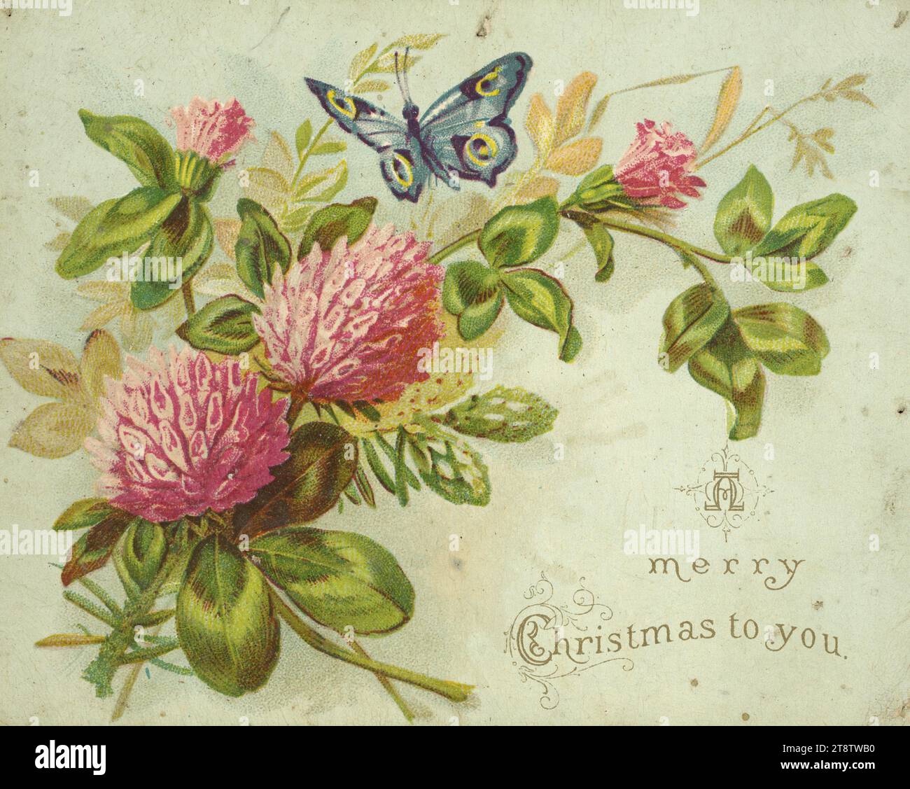 Joyeux Noël à vous. À George Shaw, Noël 87 1887, la carte de voeux de Noël imprimée seulement sur le devant montre des fleurs et des feuilles de trèfle rose, avec un papillon bleu planant au-dessus d'eux. Le texte se trouve en bas à droite. La carte est dorée Banque D'Images