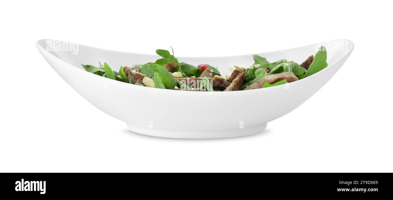 Délicieuse salade avec langue de bœuf, roquette et graines isolées sur blanc Banque D'Images