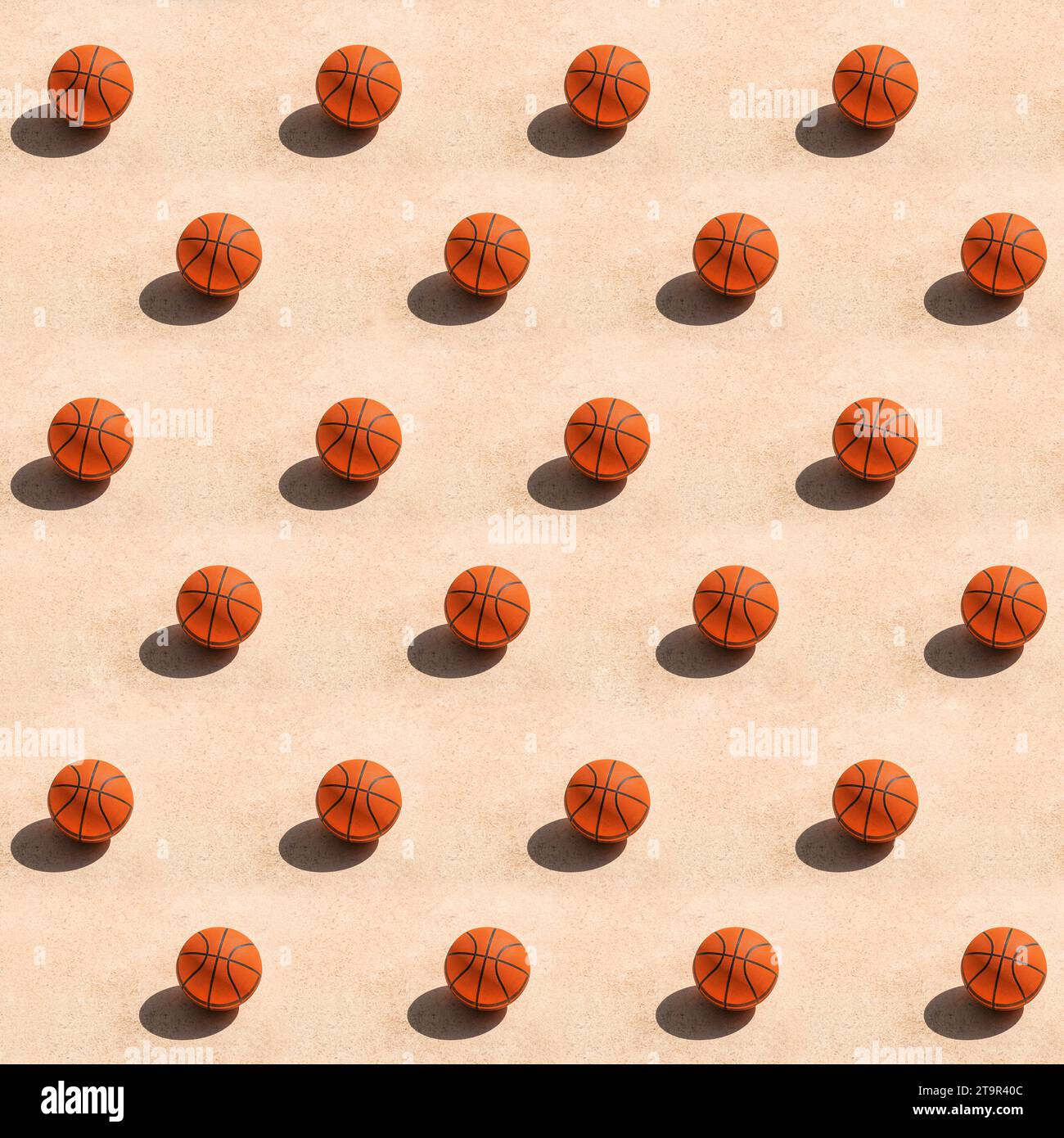 Motif tendance créatif fait avec balle de basket-ball sur une surface en béton projetant une ombre sombre sur le sol, sport de streetball et concept de loisirs. Banque D'Images