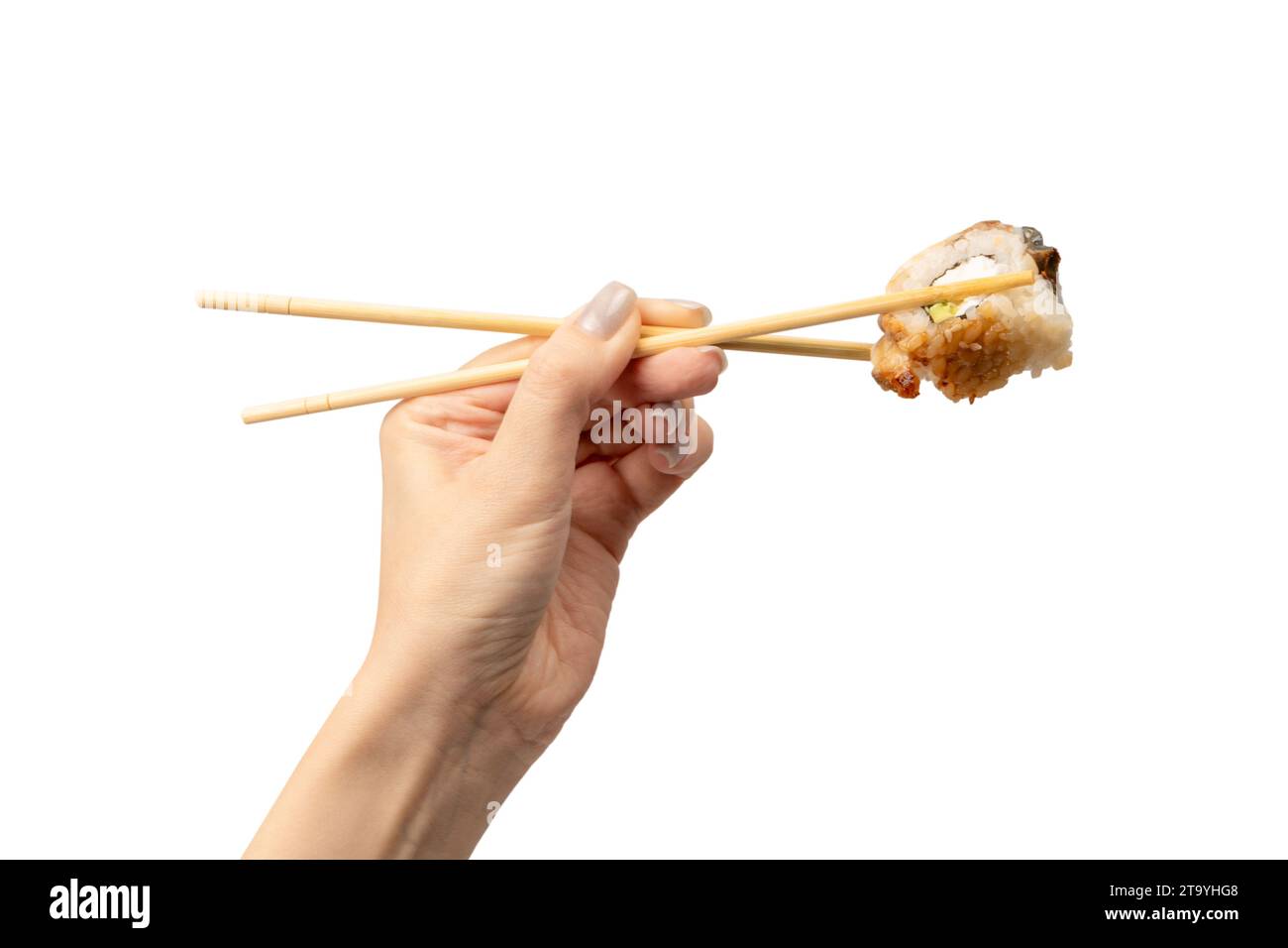 Sushi unagi dans une main de femme isolé sur un fond blanc. Banque D'Images