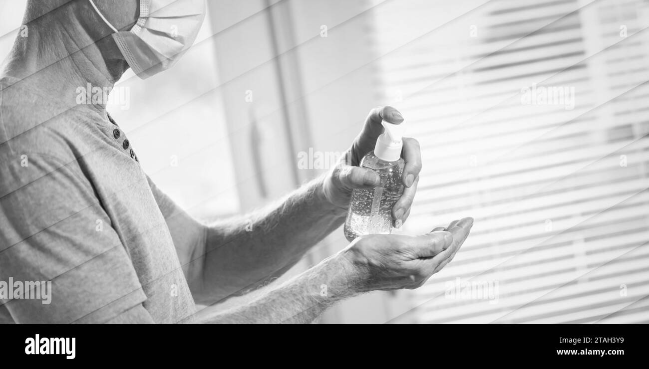 Homme utilisant le gel d'alcool désinfectant pour les mains ; prévention de l'infection virale et bactérienne, modèle géométrique Banque D'Images