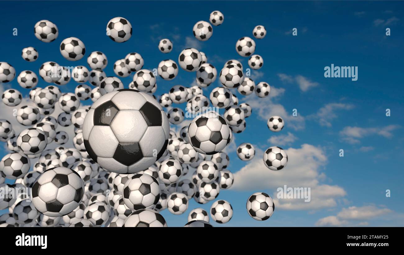 Ballons de football volants devant le ciel bleu Banque D'Images
