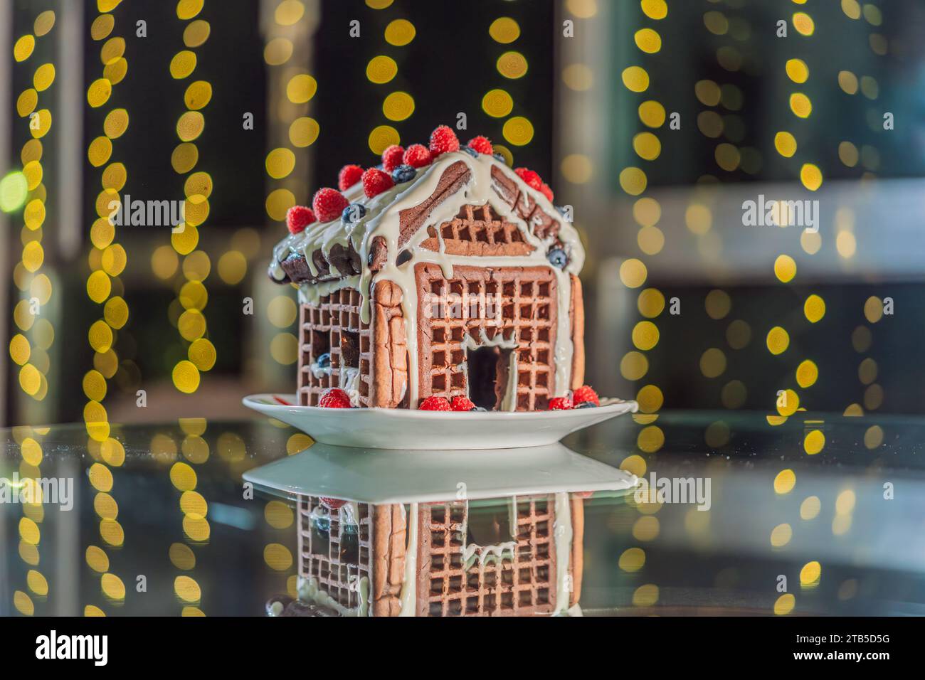 magie d'une maison inhabituelle en pain d'épice au milieu des lumières de Noël festives. Une 