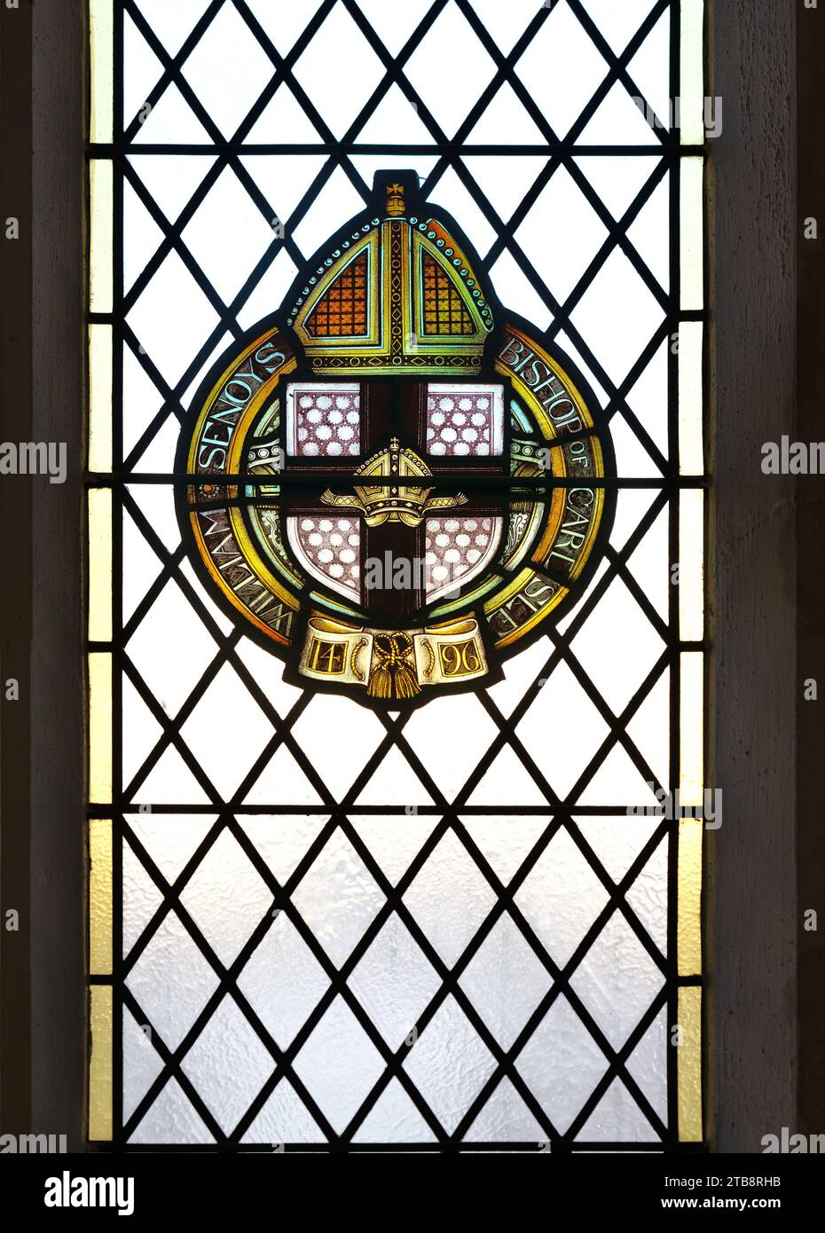Un vitrail partiel, de William Senoys, évêque de Carlisle, donateur 1496, dans l'église universitaire St Mary à Cambridge, Angleterre. Banque D'Images