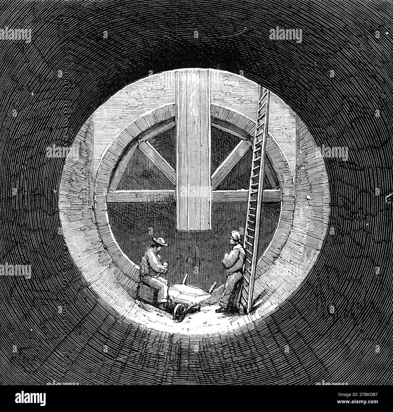 London main drainage : fond d'un puits dans l'égout de haut niveau sud à Peckham, 1861. « L'égout de haut niveau sud se compose de deux conduites, l'une commençant à Clapham et se terminant à New Cross, l'autre s'étendant de Dulwich à ce dernier endroit, d'où elles sont transportées dans la même tranchée, mais à des niveaux différents, sous les chemins de fer Brighton, North Kent, and North Woolwich Railways, et le long de la route New Cross jusqu'à Broadway à Deptford ; de ce point, ils passent par Church-Street jusqu'à Deptford Creek, et, comme la tranchée dans laquelle ils doivent être construits sera toute la largeur de ceci Banque D'Images