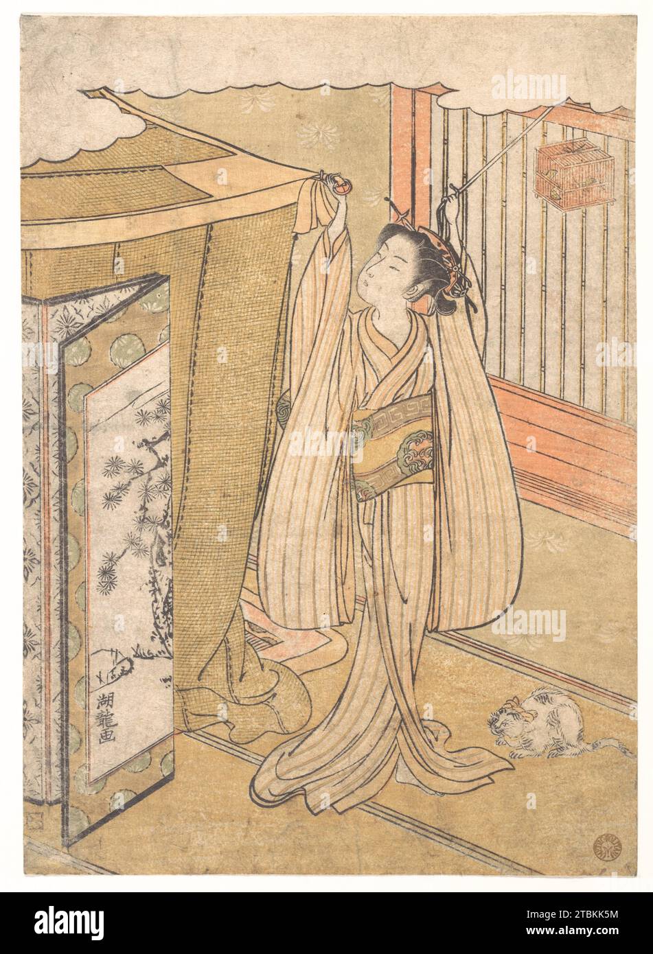 Une fille accrochant une moustiquaire au-dessus de son lit. 1918 par Isoda Koryusai Banque D'Images