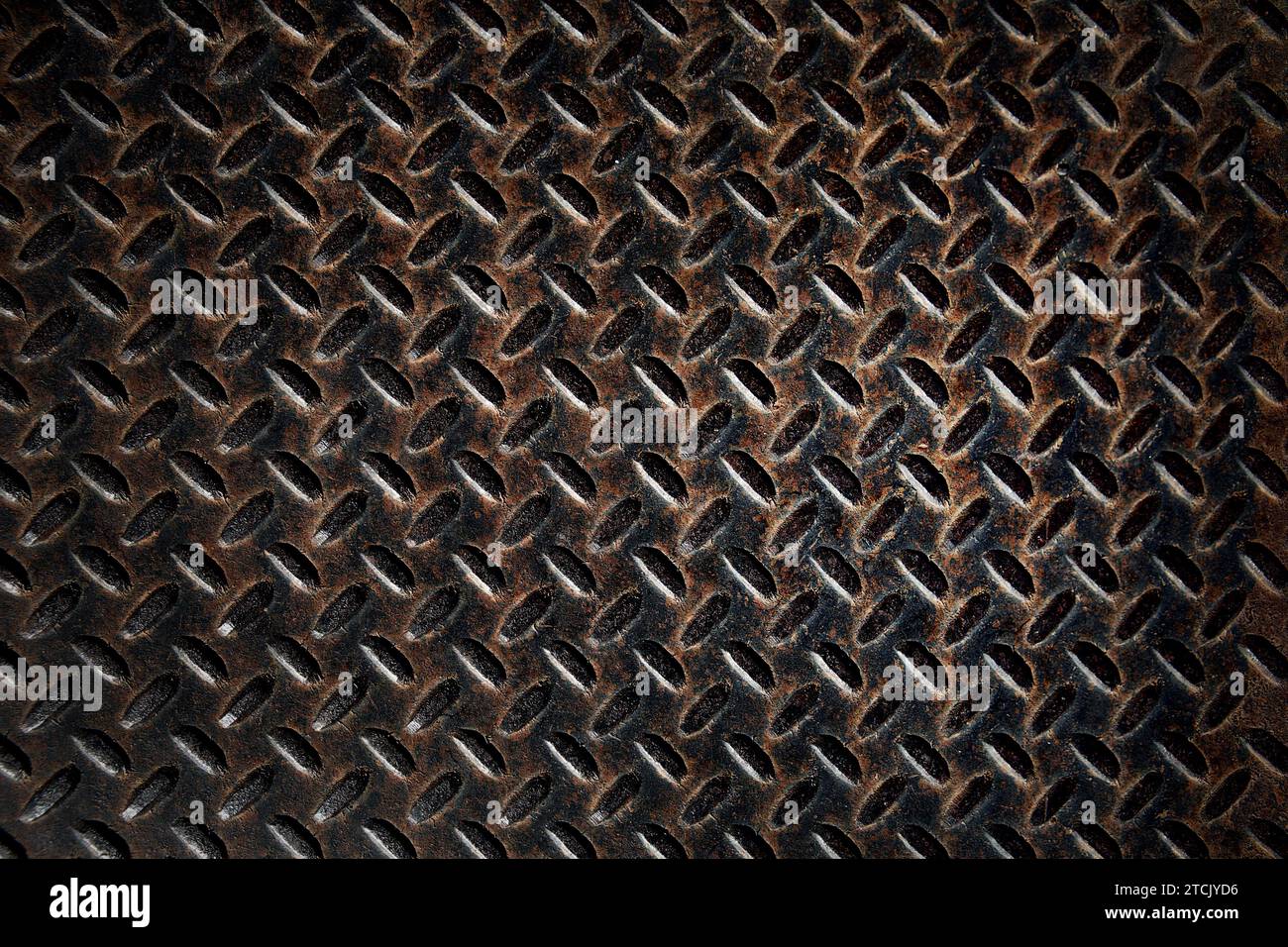 Vieux motif de texture de plaque de métal de diamant rouillé utilisé comme fond abstrait Banque D'Images