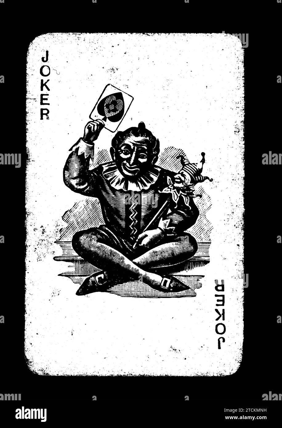 Vintage joker carte à jouer en noir et blanc sur un fond noir. Banque D'Images