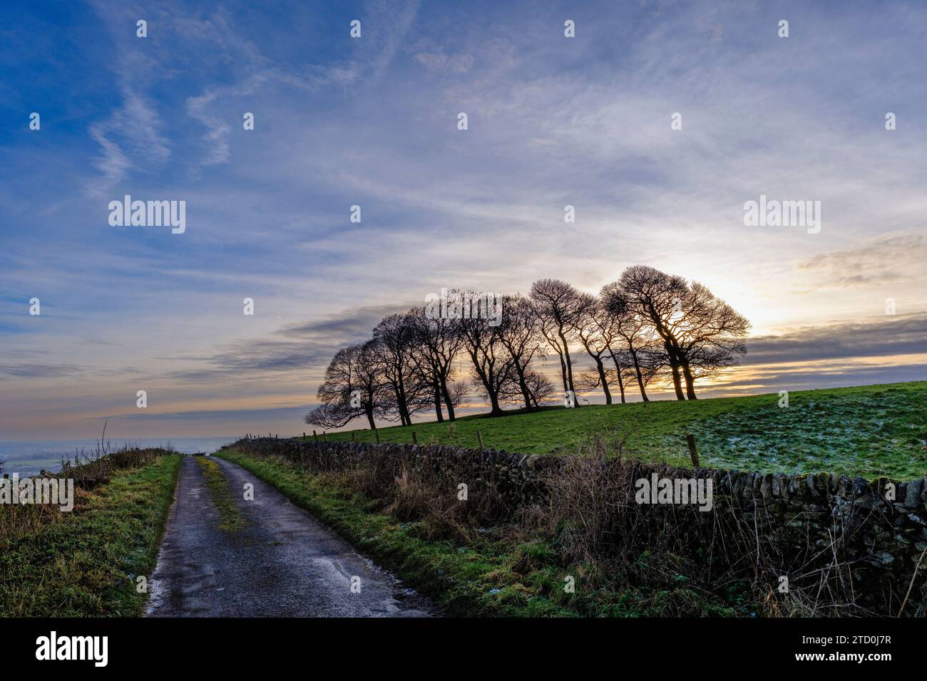 Coucher de soleil à gag Lane, Thorpe, Peak District National Park, Derbyshire, Angleterre Banque D'Images