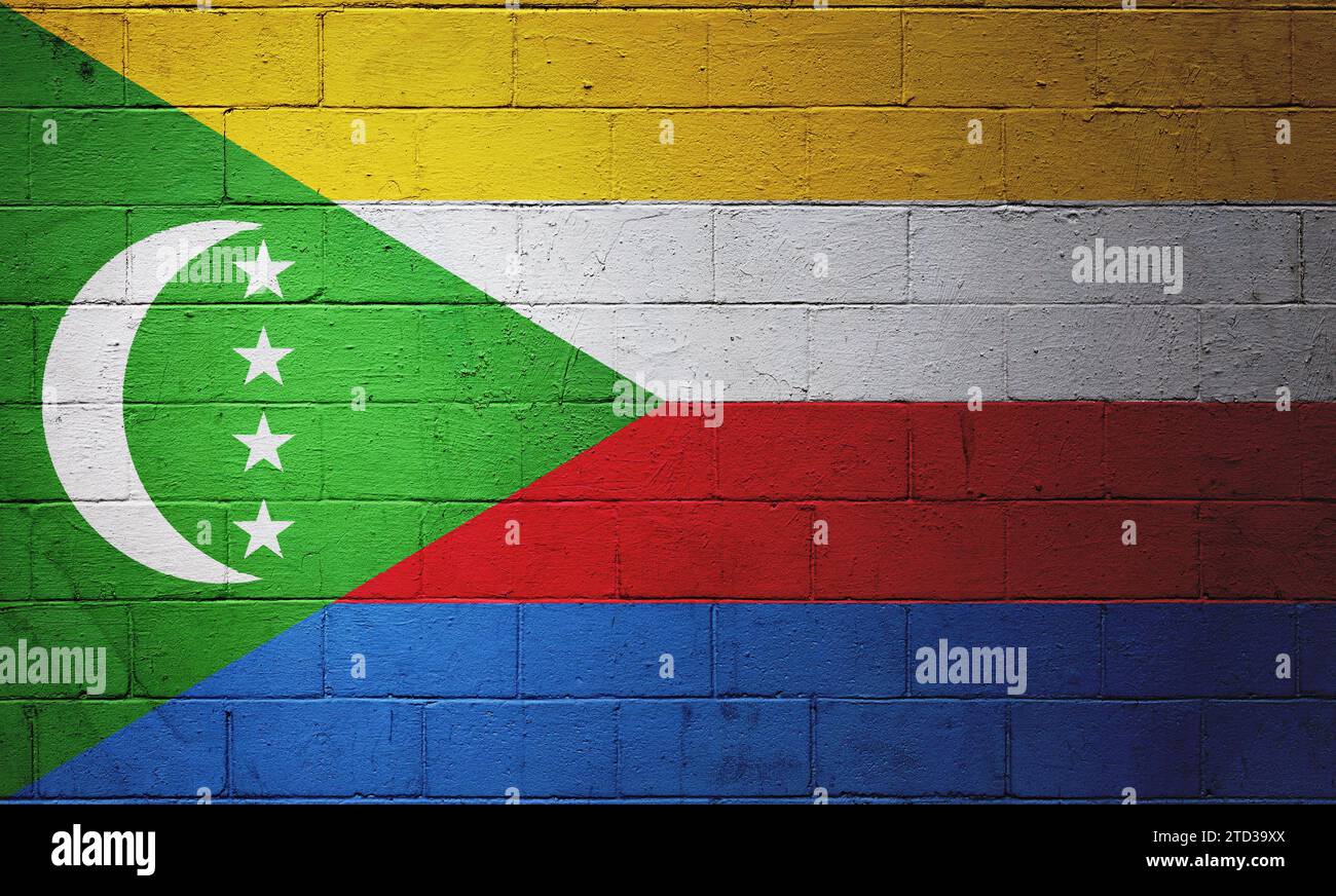 Drapeau des Comores peint sur un mur de blocs de cendre. Banque D'Images