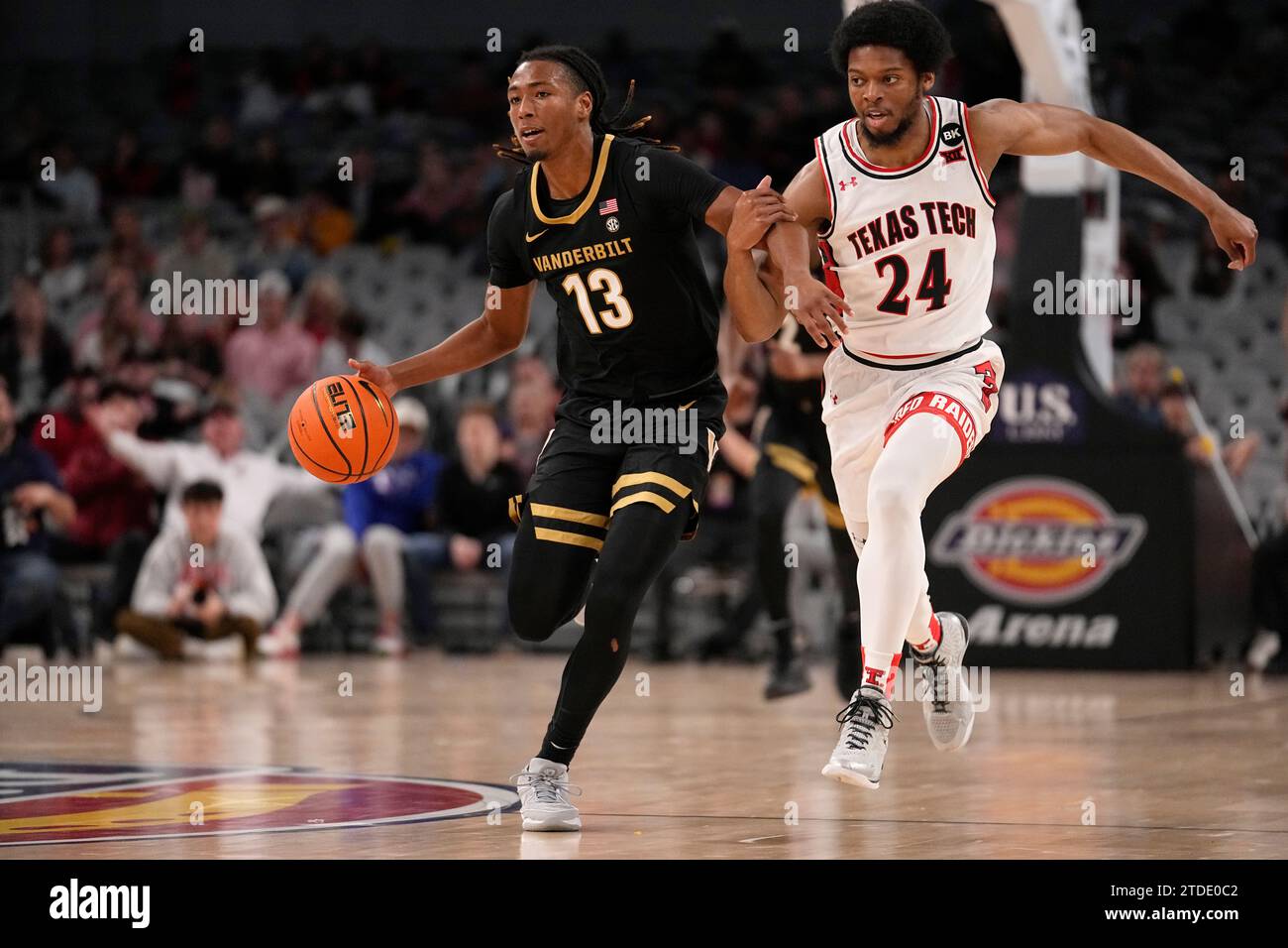Vanderbilt guard Malik Presley (13) dribbles up court after grabbing a loose ball in front of Texas Tech guard Kerwin Walton (24) in the second half of an NCAA college basketball game in Fort Worth, Texas, Saturday, Dec. 16, 2023. (AP Photo/Tony Gutierrez) Banque D'Images