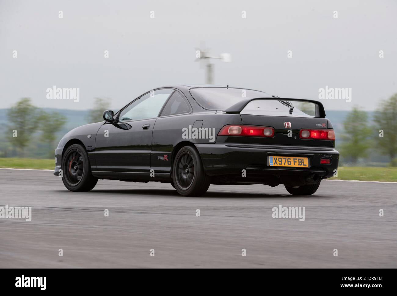 Honda Integra type R conduite rapide sur piste lors d'une journée de course Banque D'Images