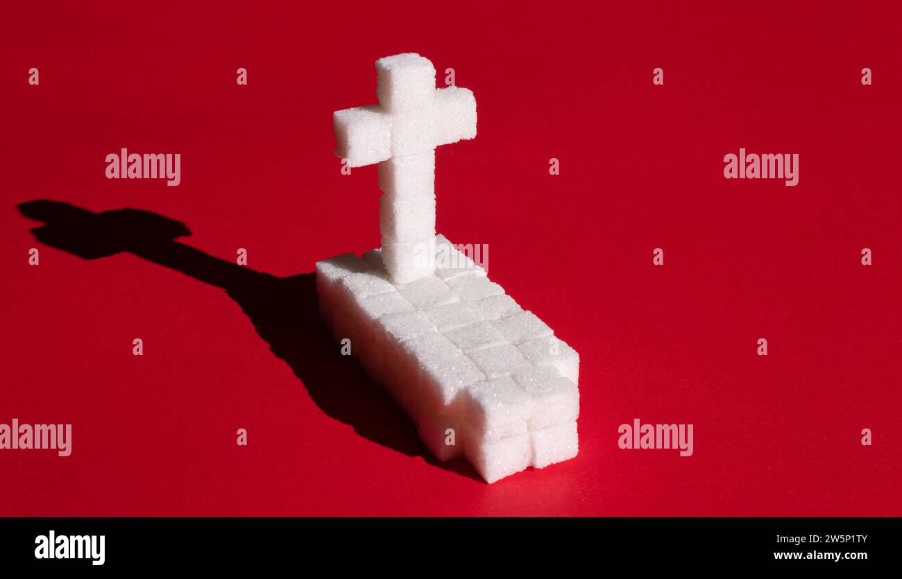 Tombe faite de cubes de sucre. Dépendance au sucre et concept de problème de diabète. Banque D'Images