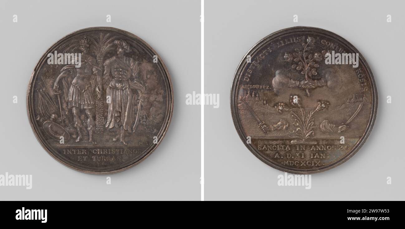 Convention de Karlowitz entre l'Empereur, la Pologne, la Russie, Venise et la Turquie, Martin Schmeltzing, médaille d'histoire 1699 Médaille d'argent. Devant : l'empereur allemand atteint le sultan turc sous un olivier, dans le fond de la bataille maritime ; coupe : inscription. Revers : deux mains avec une épée séparées l'une de l'autre par un buisson de lys, au-dessus de ces deux mains effondrées qui tiennent le buisson de rose ; dans le fond de Karlowitz et camp de tentes dans Kerschrift ; coupe : inscription. Amsterdam argent (métal) frappe (travail des métaux) Sremski Karlovci. Voïvodine. Pologne. Sibérie. Venise. Turkije Banque D'Images