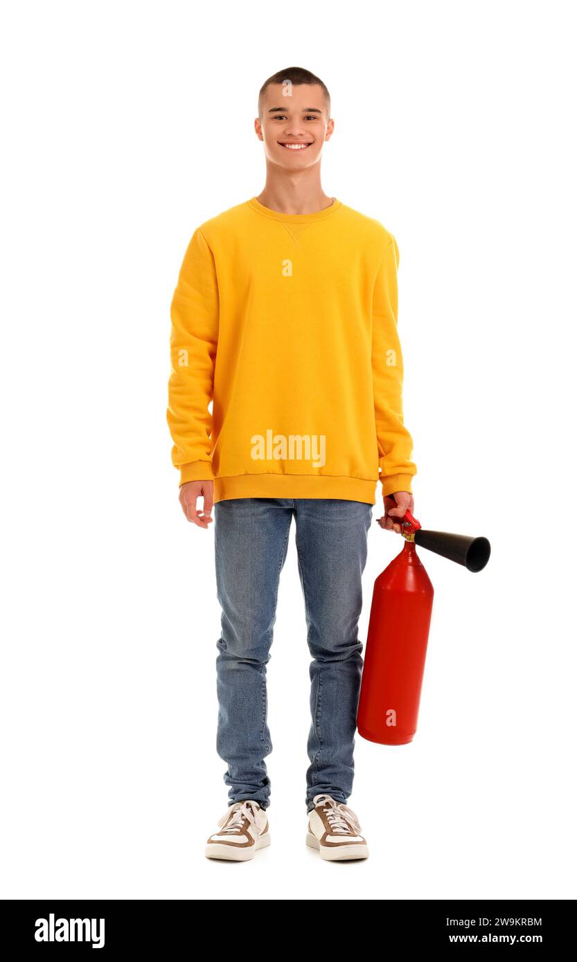 Adolescent garçon avec extincteur sur fond blanc Banque D'Images