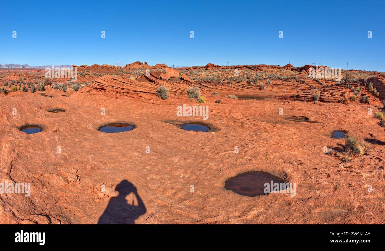 Ombre d'une personne prenant une photo dans les badlands de Horseshoe Bend près de page, Arizona, USA Banque D'Images
