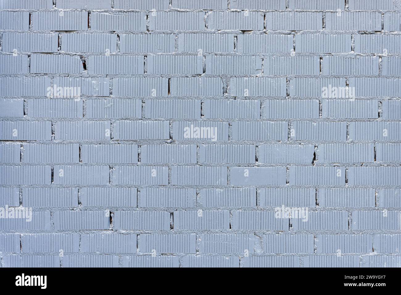 Fond d'un mur en briques peintes grises Banque D'Images