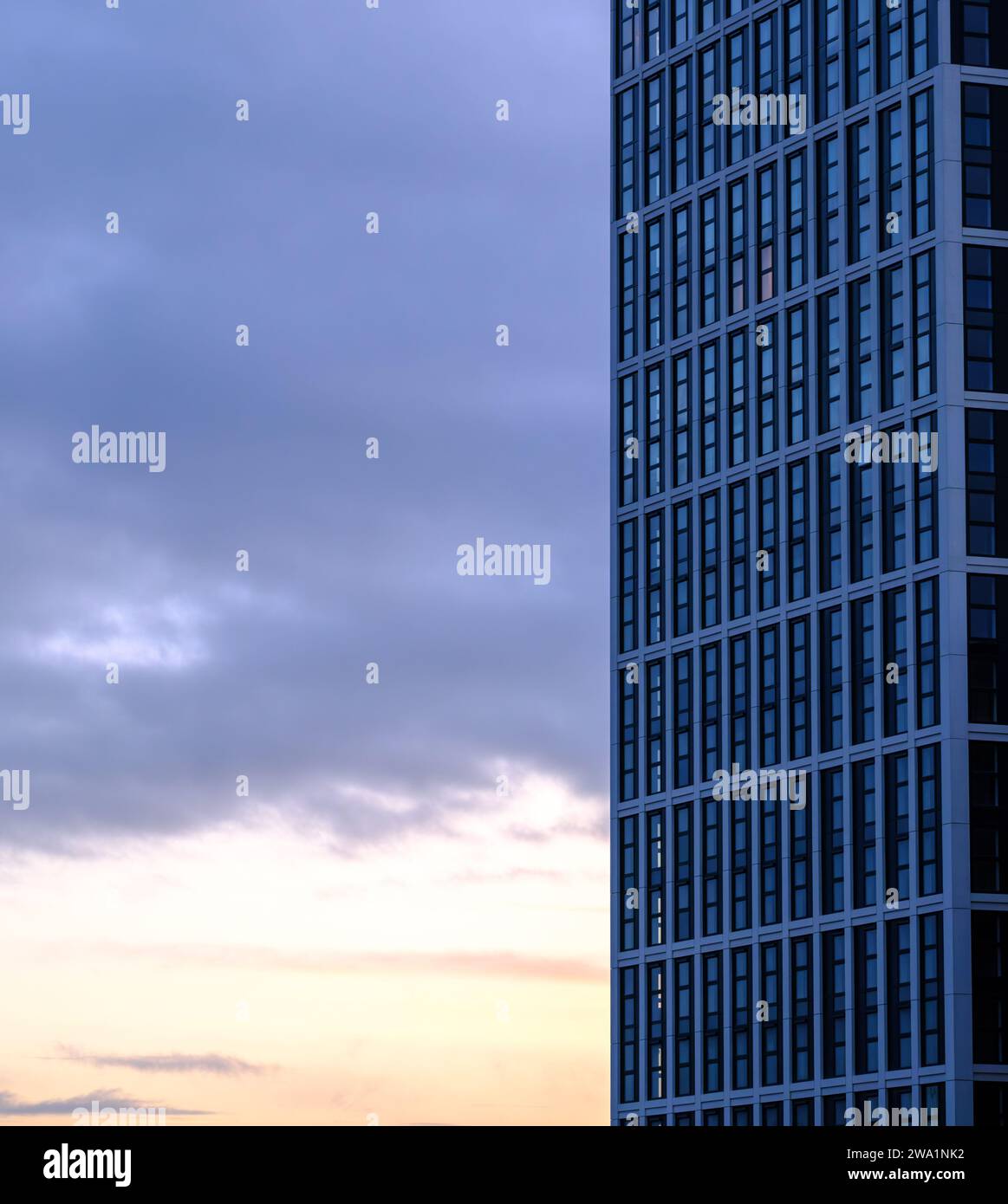 Generic Modern Downtown Apartment Building at Dusk with Copy Space Banque D'Images