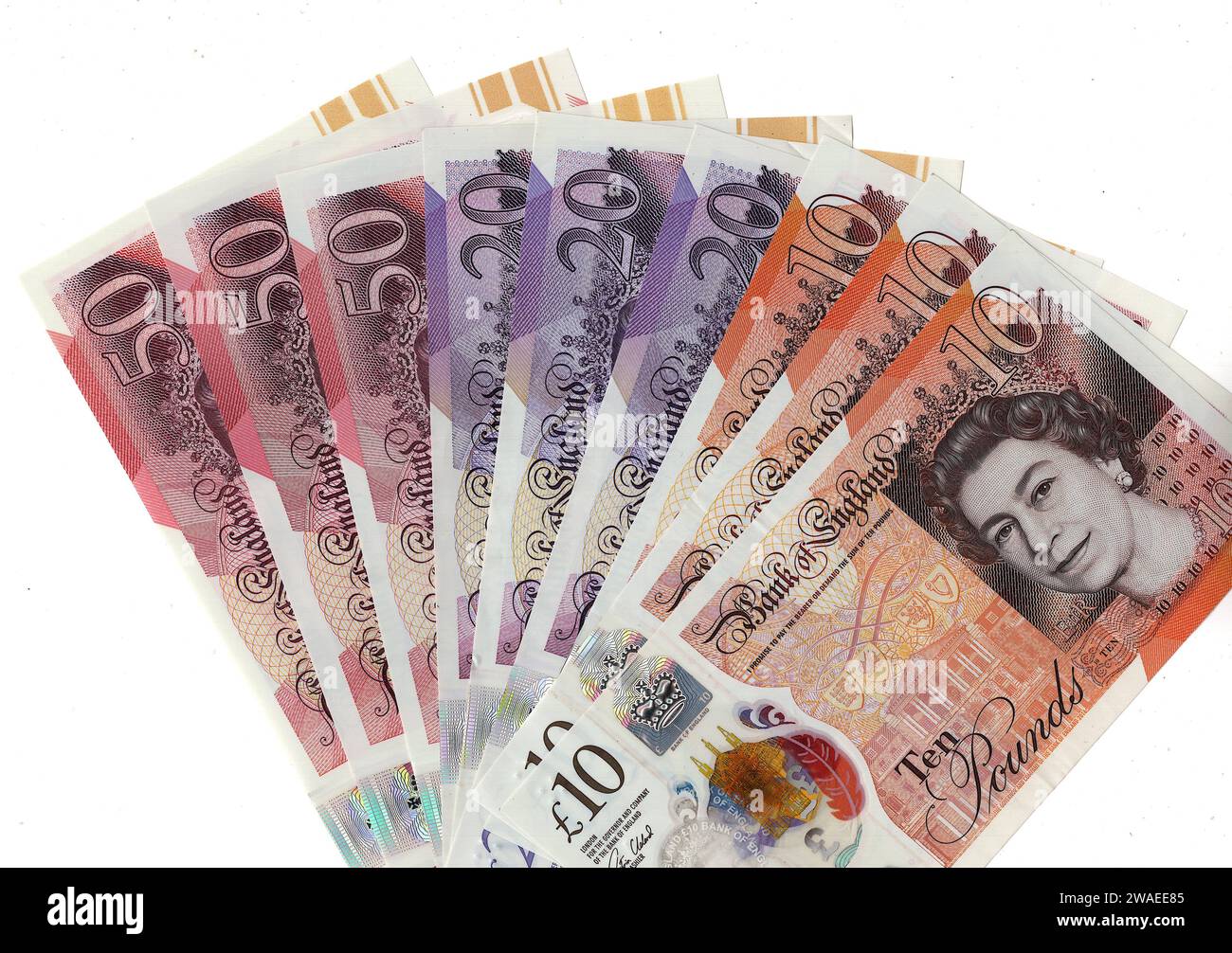 Un fan de billets de banque du Royaume-Uni/Grande-Bretagne isolé sur un fond blanc. Banque D'Images