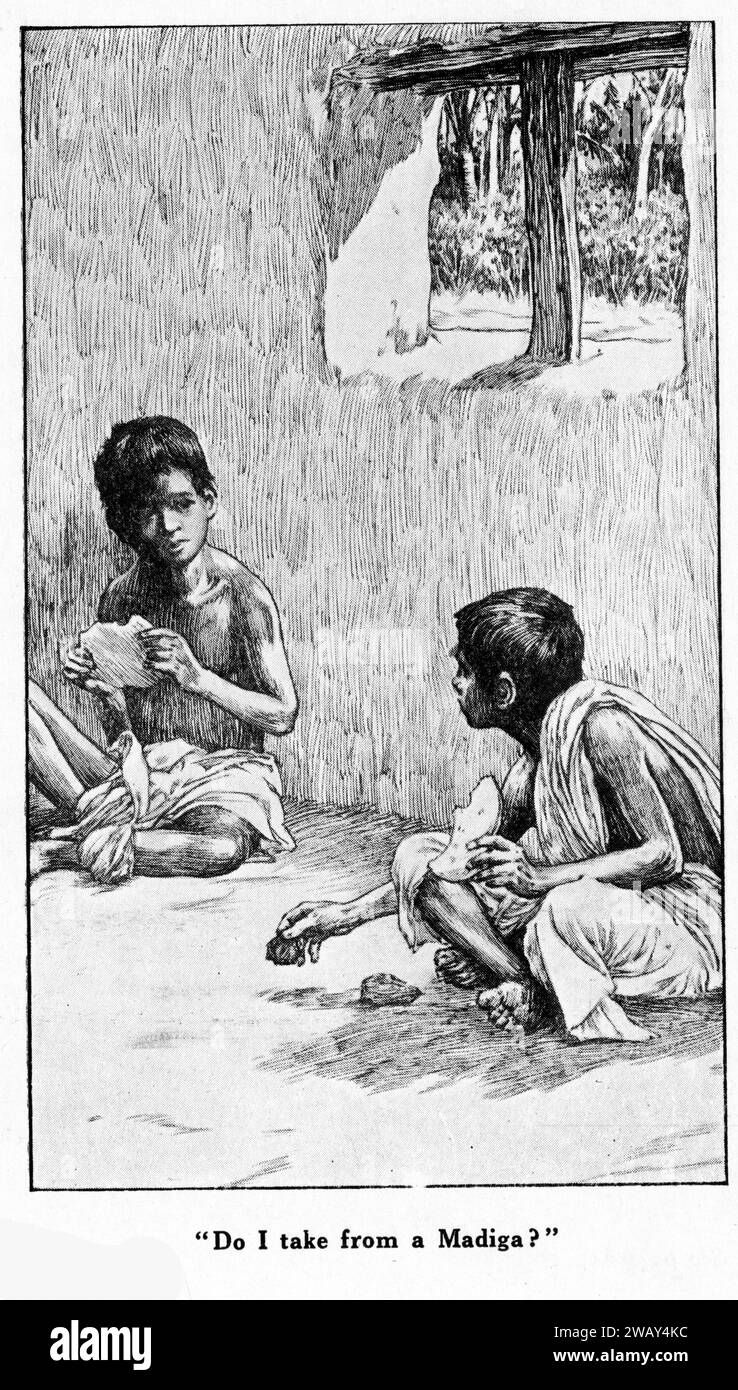Gravure de deux garçons assis dans une cabane de village en Inde, vers 1928. Banque D'Images