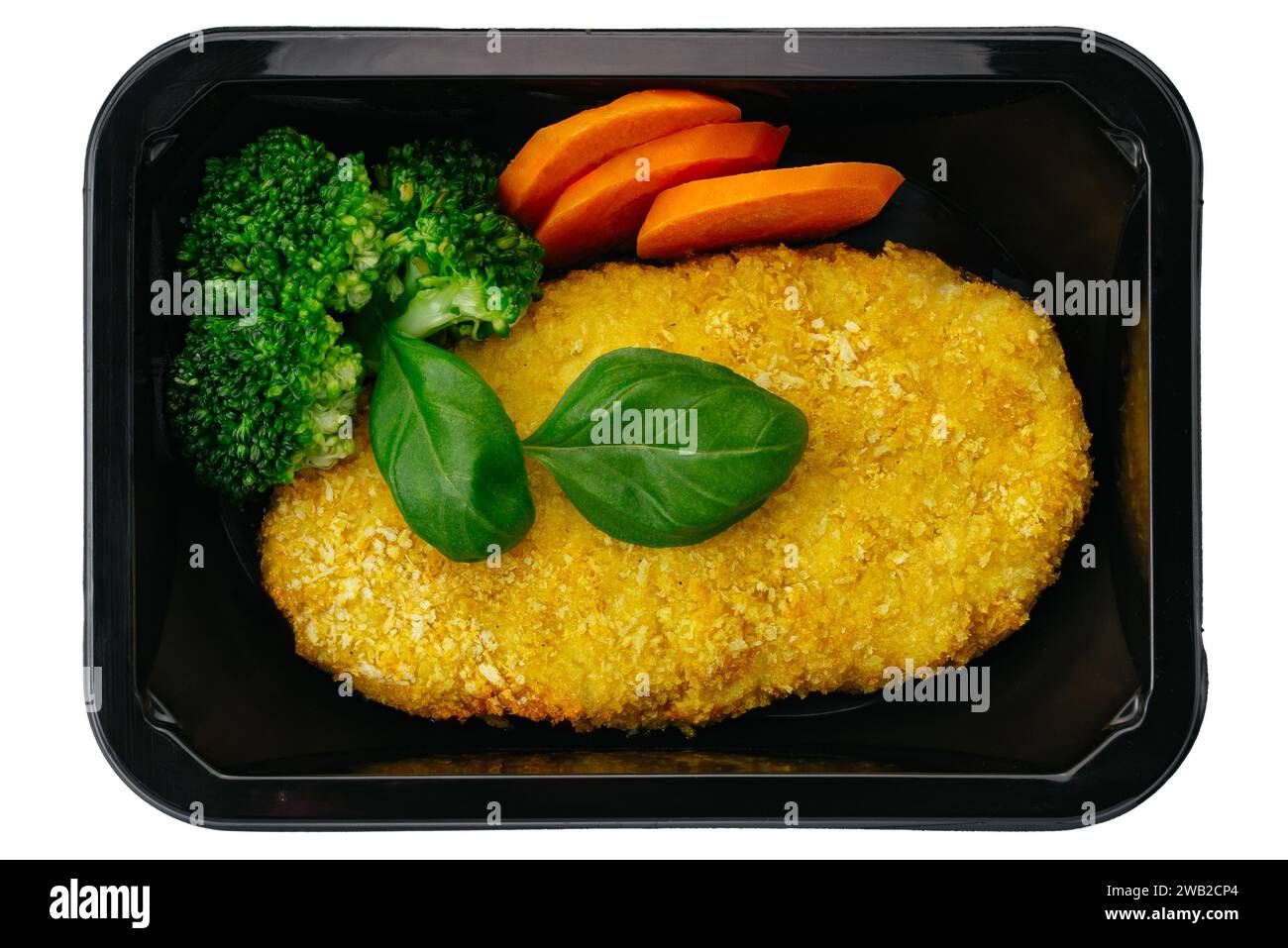 schnitzel de poulet avec plat d'accompagnement dans une boîte à lunch sur un fond blanc Banque D'Images