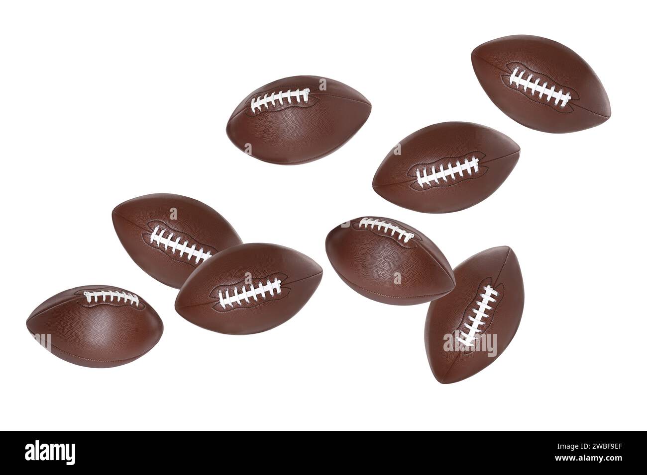 Beaucoup de balles de football américain volant sur fond blanc Banque D'Images