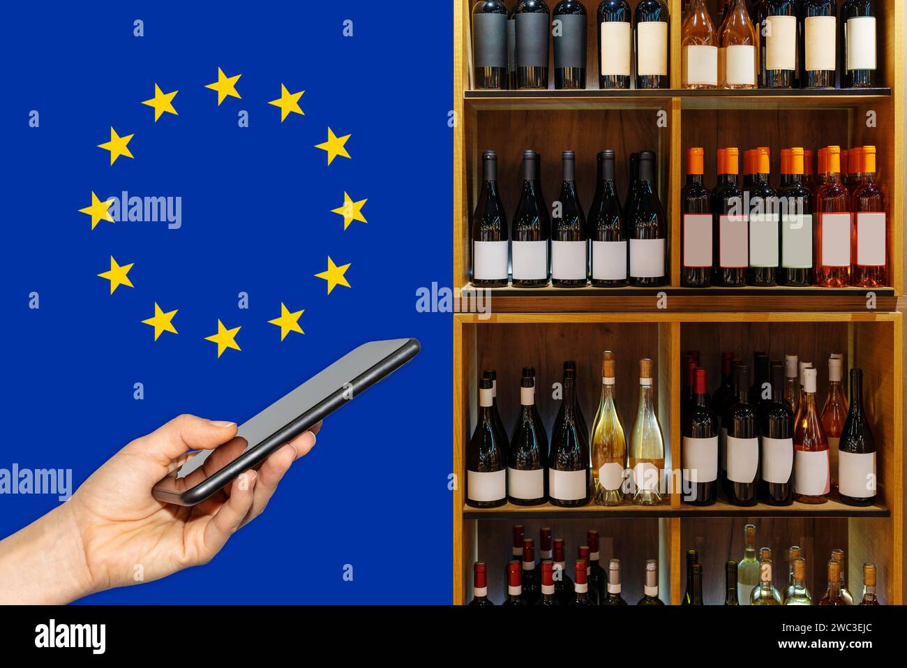 Téléphone portable devant les bouteilles de vin et drapeau de l'Union européenne. Banque D'Images