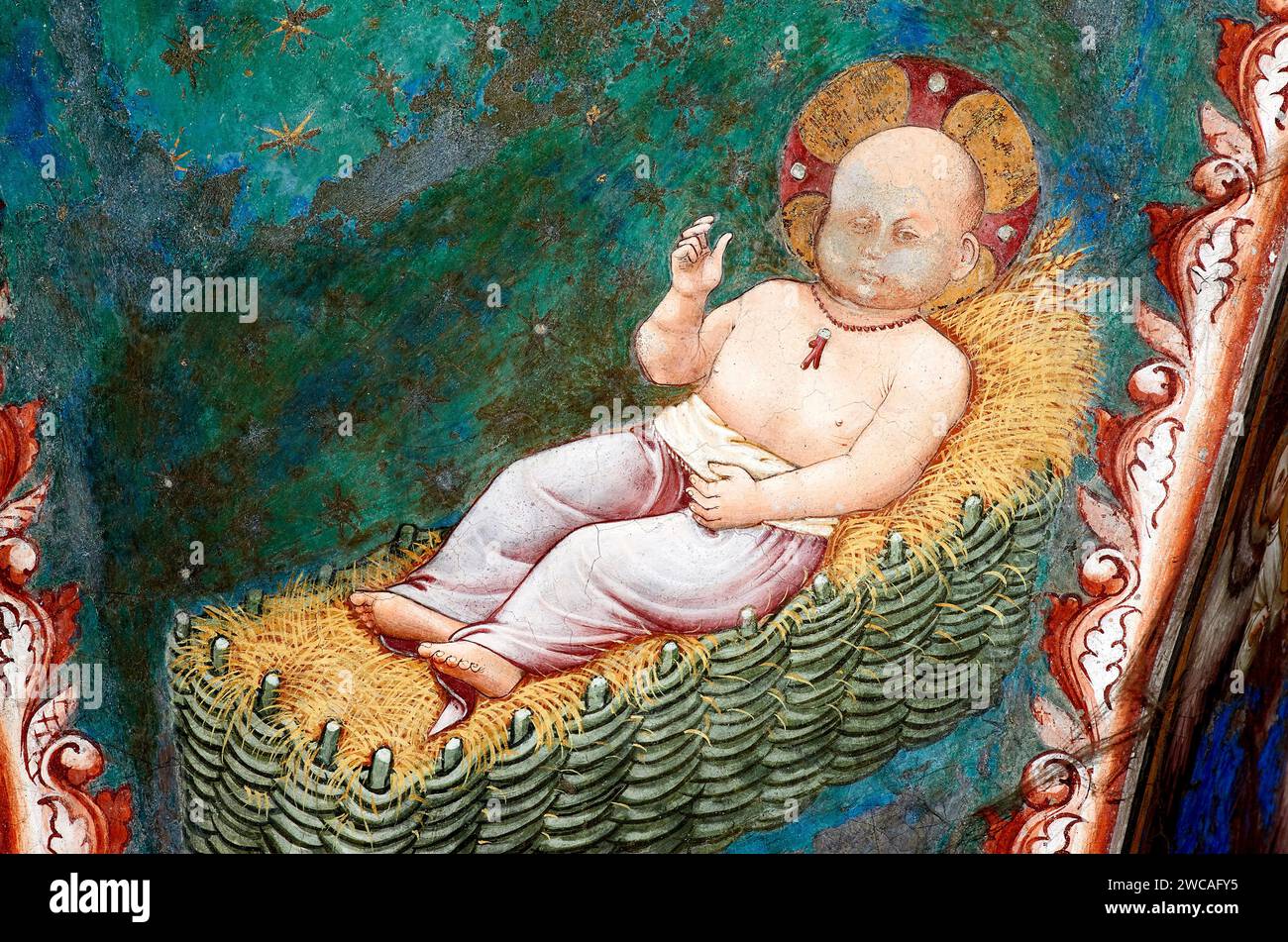 Gesù Bambino nella mangiatoia,con collana di corallo che allontana il male - affresco - pittore emiliano neogiottesco del 1425 - Vignola (Mo), Cap Banque D'Images