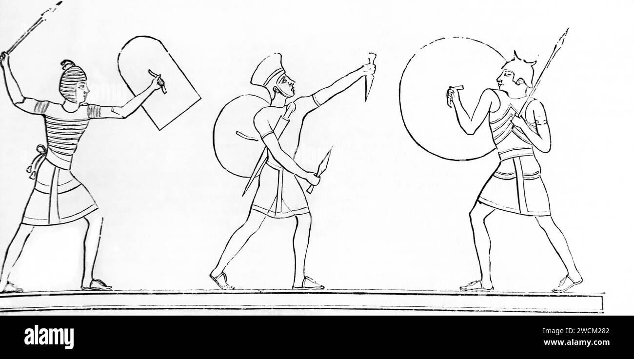 Gravure sur bois d'une sculpture à Thèbes montrant les boucliers communs contrastés des Égyptiens de la Bible de la famille illustrée Banque D'Images