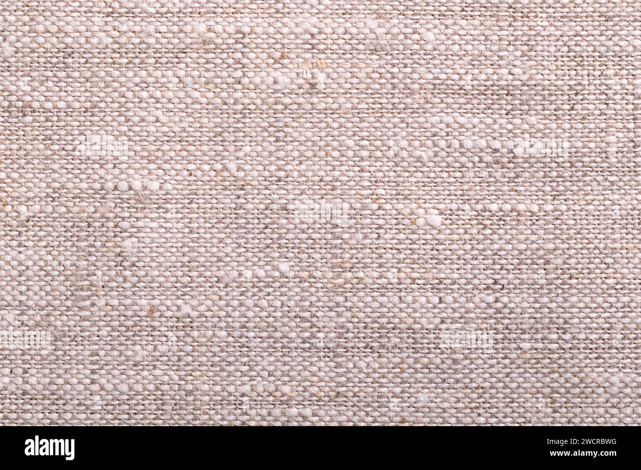 Tissu en lin, surface, par le haut. Textile fabriqué à partir des fibres de la plante de lin. Le lin est très résistant et absorbant et sèche plus vite que le coton. Banque D'Images