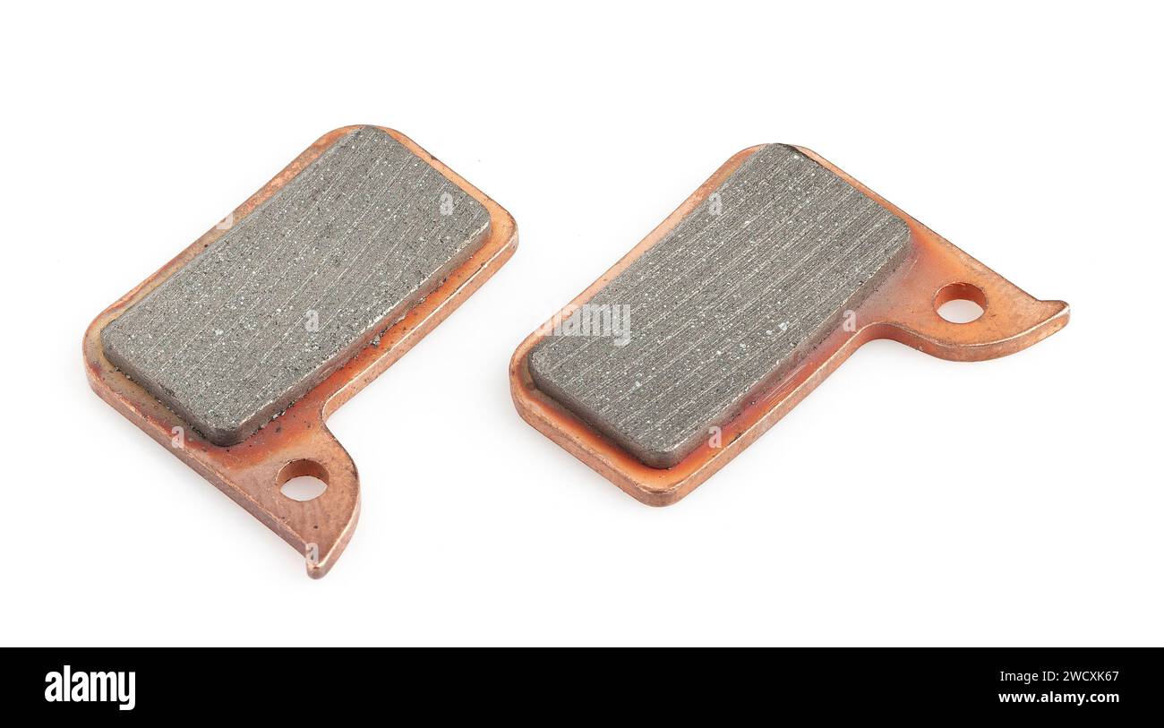 Nouvelles plaquettes de frein à disque de vélo isolées sur blanc Banque D'Images