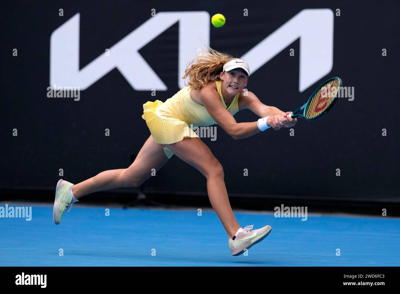 Mirra Andreeva of Russia plays a backhand return to Diane Parry of France during their third round match at the Australian Open tennis championships at Melbourne Park, Melbourne, Australia, Friday, Jan. 19, 2024. (AP Photo/Louise Delmotte) Banque D'Images