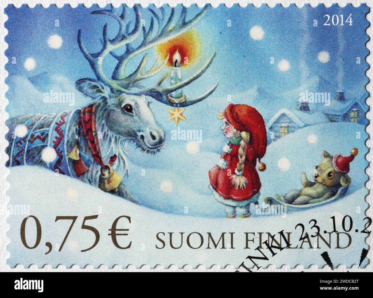 Fille et renne dans un timbre de noël finlandais Banque D'Images