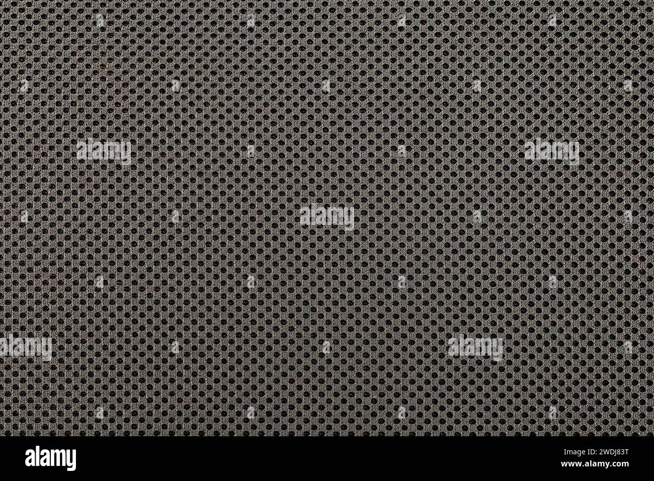 Fond gris. Texture textile avec petits points. Fils noirs tressés à tricoter. Banque D'Images