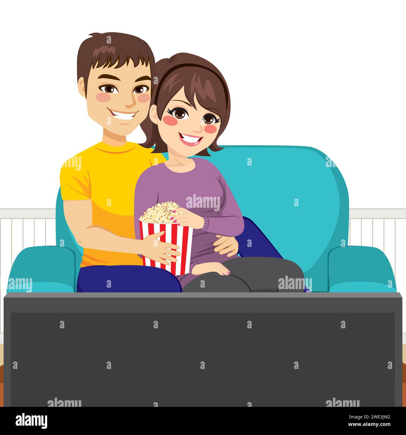 Mignon jeune couple regardant un film ensemble sur le canapé et mangeant du pop-corn Banque D'Images