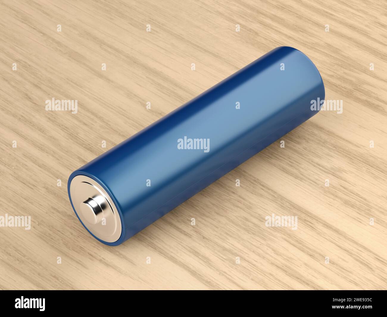 Pile bleue de taille AA sur la table en bois Banque D'Images