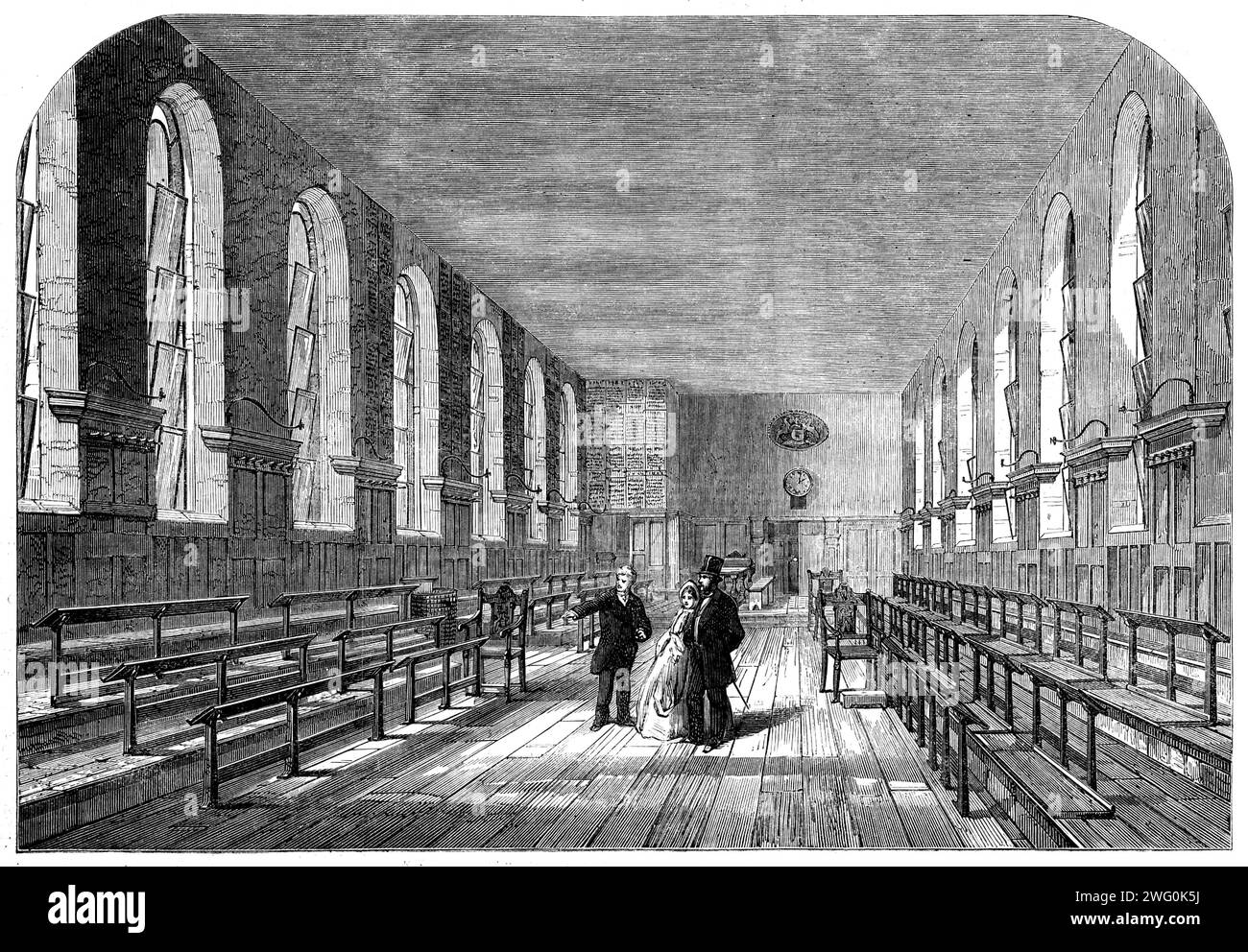 La salle de classe supérieure de Merchant Taylorss' School, [ville de Londres], 1862. 'L'ancienne pile, comme tant d'autres édifices publics et privés de Londres, a été détruite par le Grand incendie. À sa place, le bâtiment actuel et la maison attenante (qui jusqu'en 1856 a été utilisée comme résidence pour le maître en chef) ont été érigés, en 1675. En l'espèce, comme dans le cas de l'achat initial, la dépense a été défrayée par des membres de la Merchant Taylors 'Company, sans empiéter sur les fonds affectés aux fins de l'entreprise. Les locaux se composent maintenant d'une salle de classe supérieure commode ; deux salles d'écriture, formées en 182 Banque D'Images