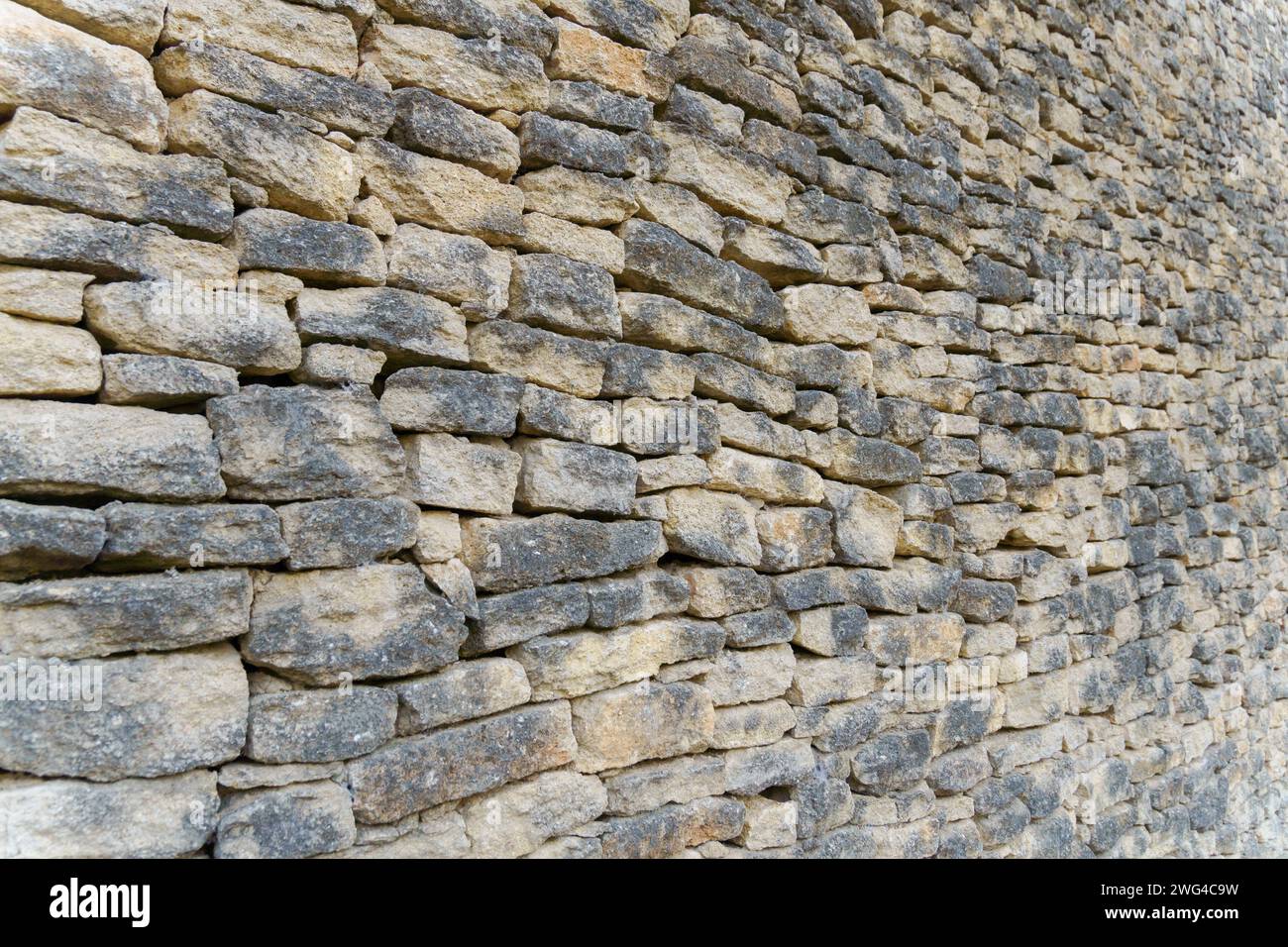 Gros plan d'un mur de pierre empilé Banque D'Images