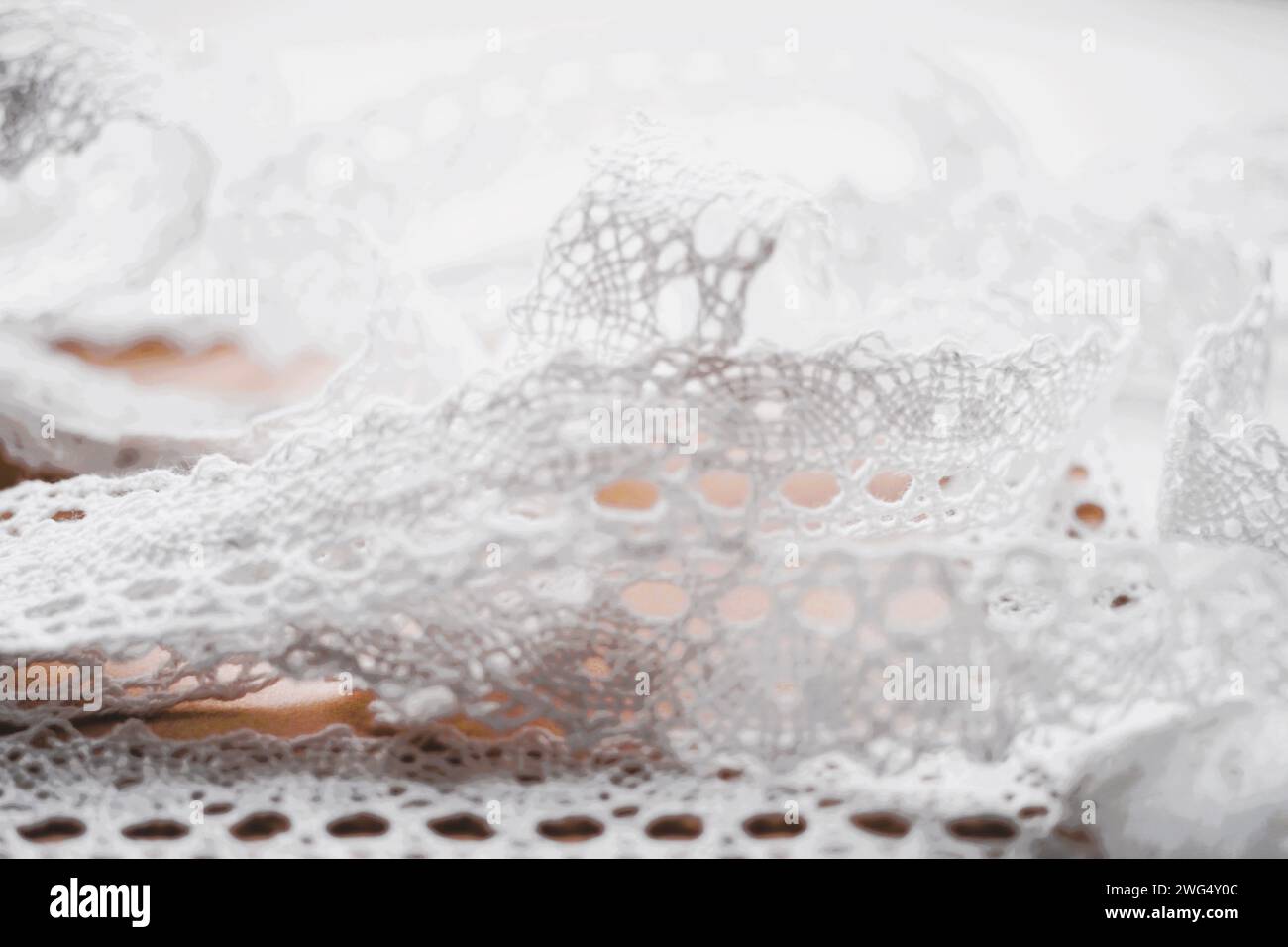 Vue rapprochée du ruban de dentelle blanc tendre. Banque D'Images