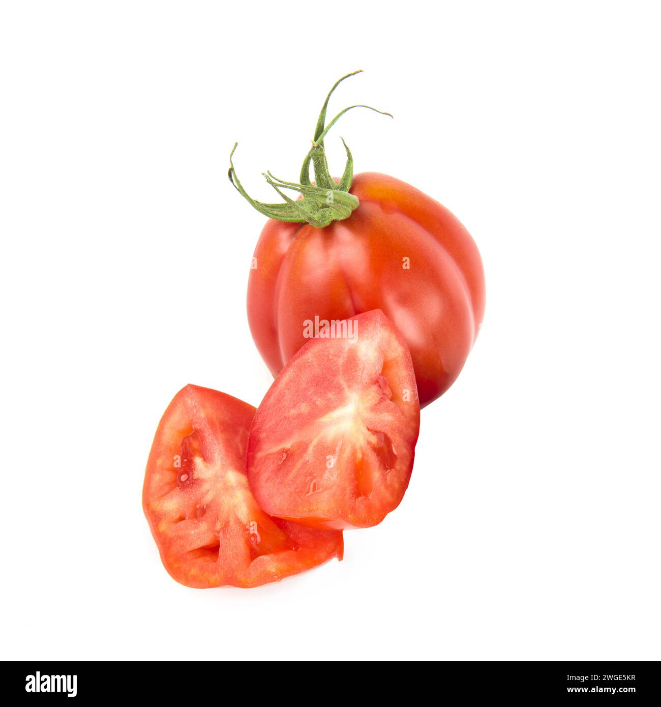 Tomates mûres isolé sur fond blanc. Banque D'Images